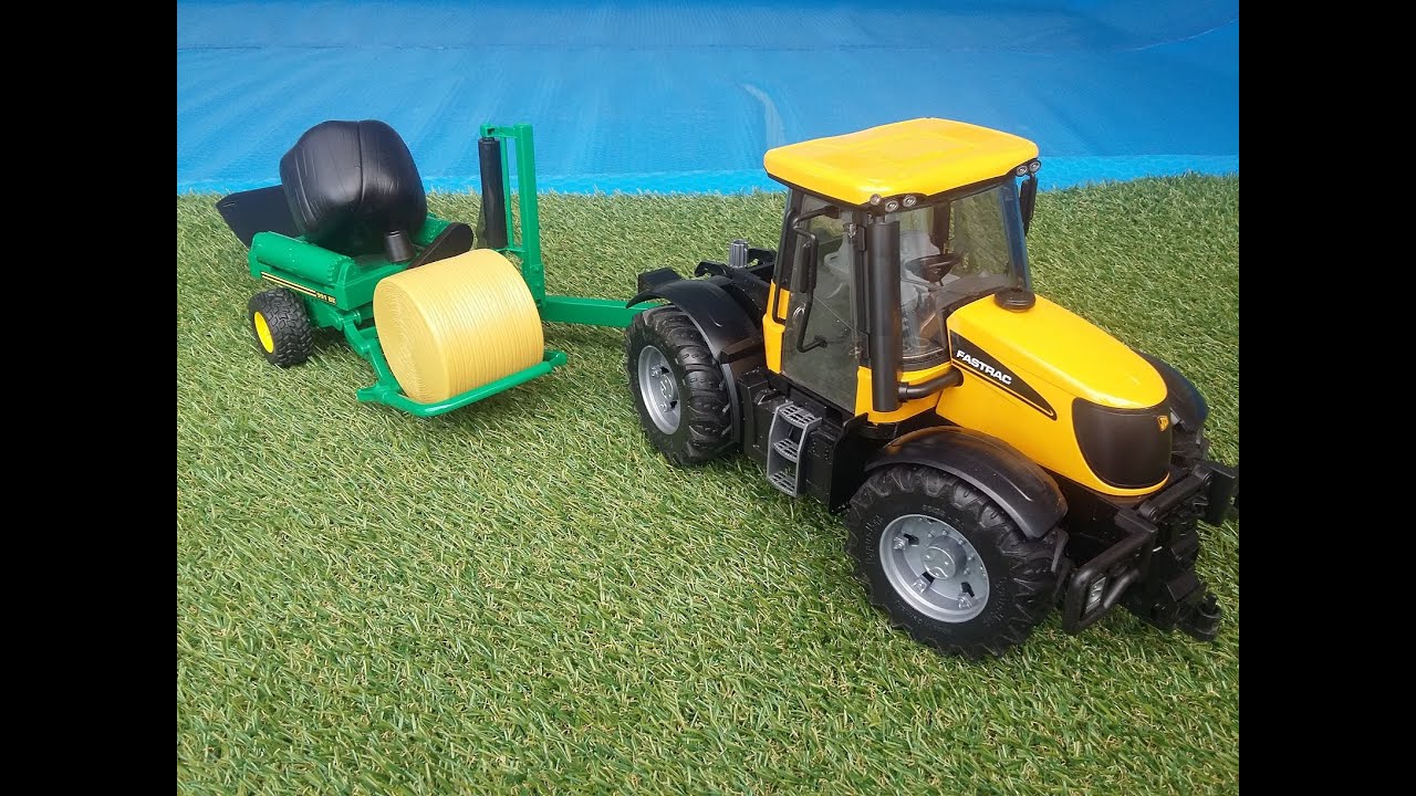 bruder tractor with hay bales